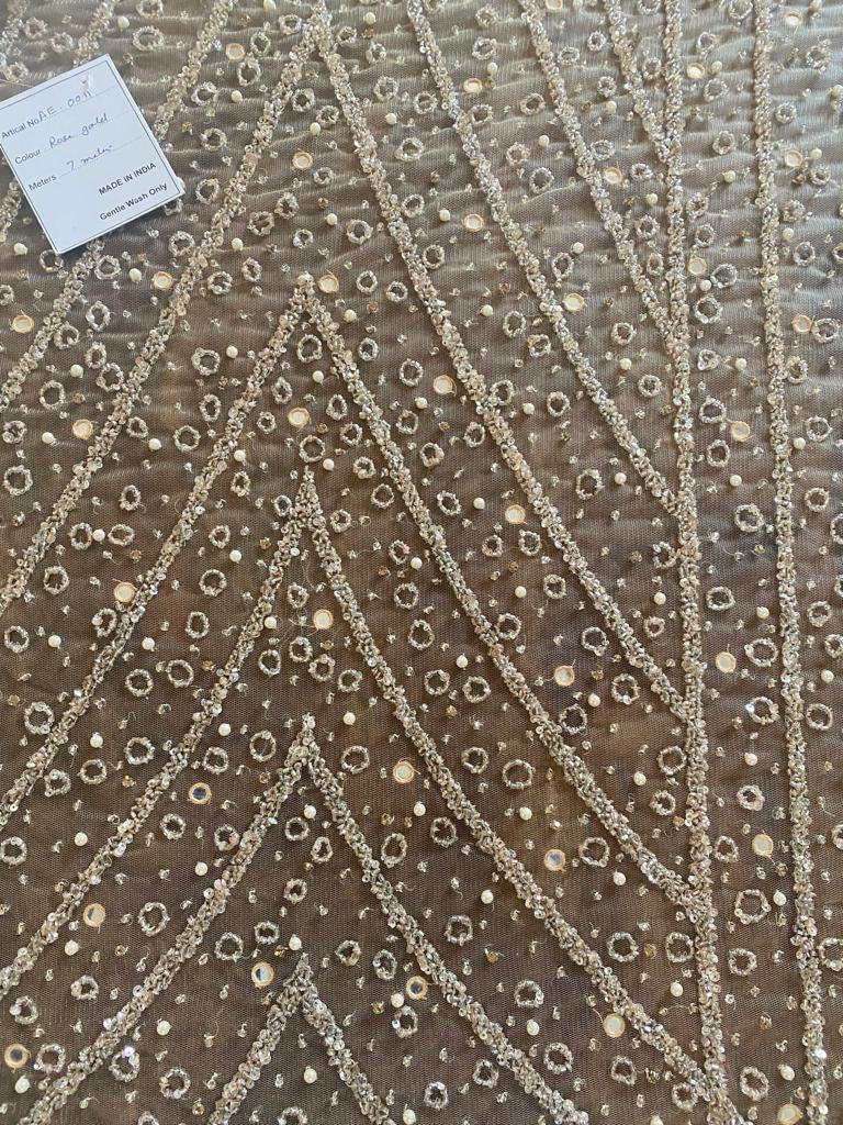 embellished fabric with beads and pearls, hand embroidered for evening gown or bridal wear