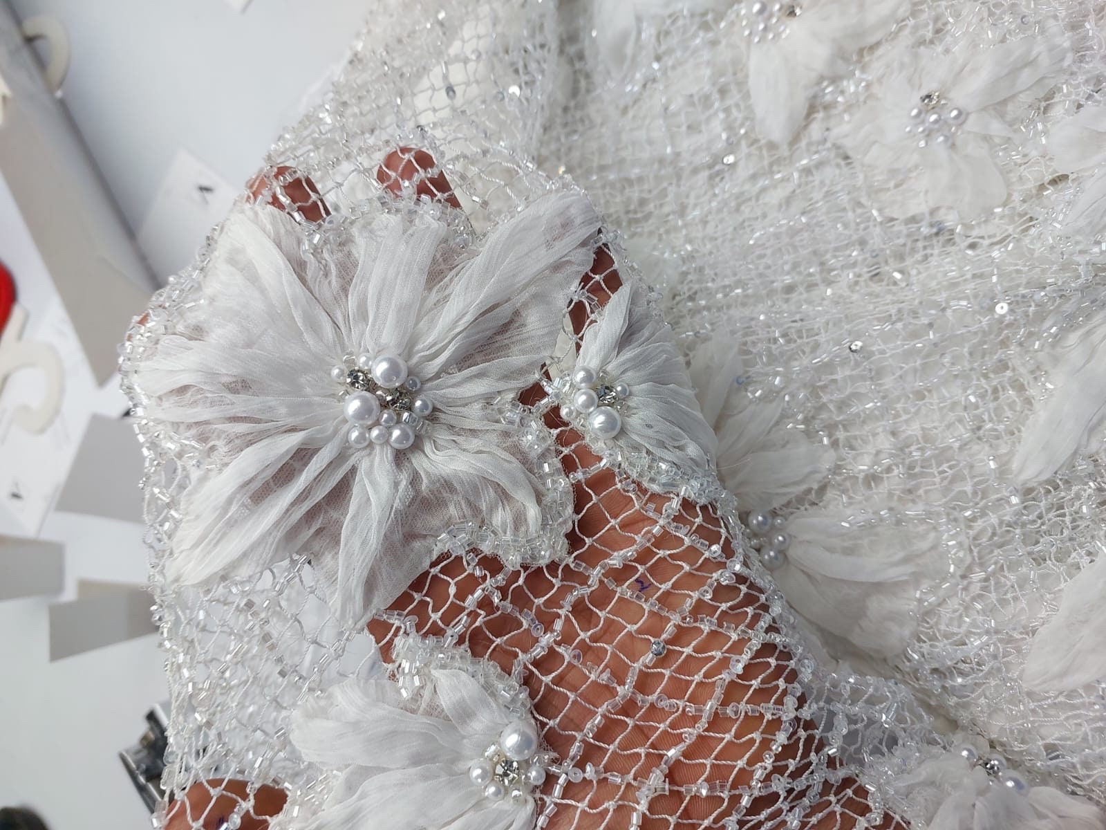 Ellie saab in hand embroidery with hand cut applique organza flowers and cut beads,  pearls, color white, off white, ivory. Champagne