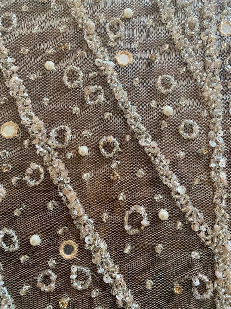 embellished fabric with beads and pearls, hand embroidered for evening gown or bridal wear